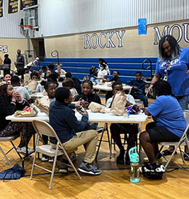 Students eating bagged lunches