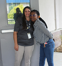 Two employees smiling