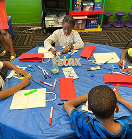 Students decorating gift bags