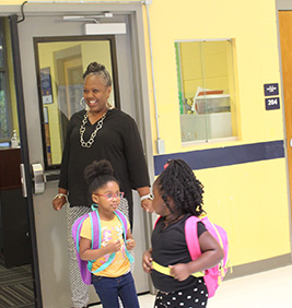 Students in hallway with backpacks